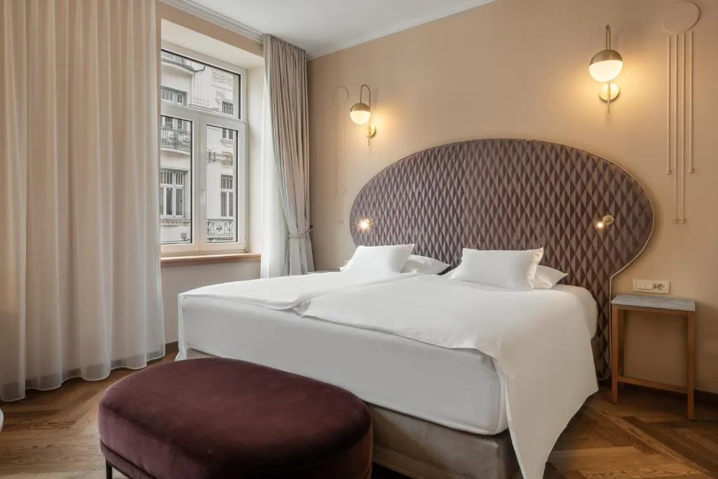 Grand Deluxe Room interior with chestnut finishes