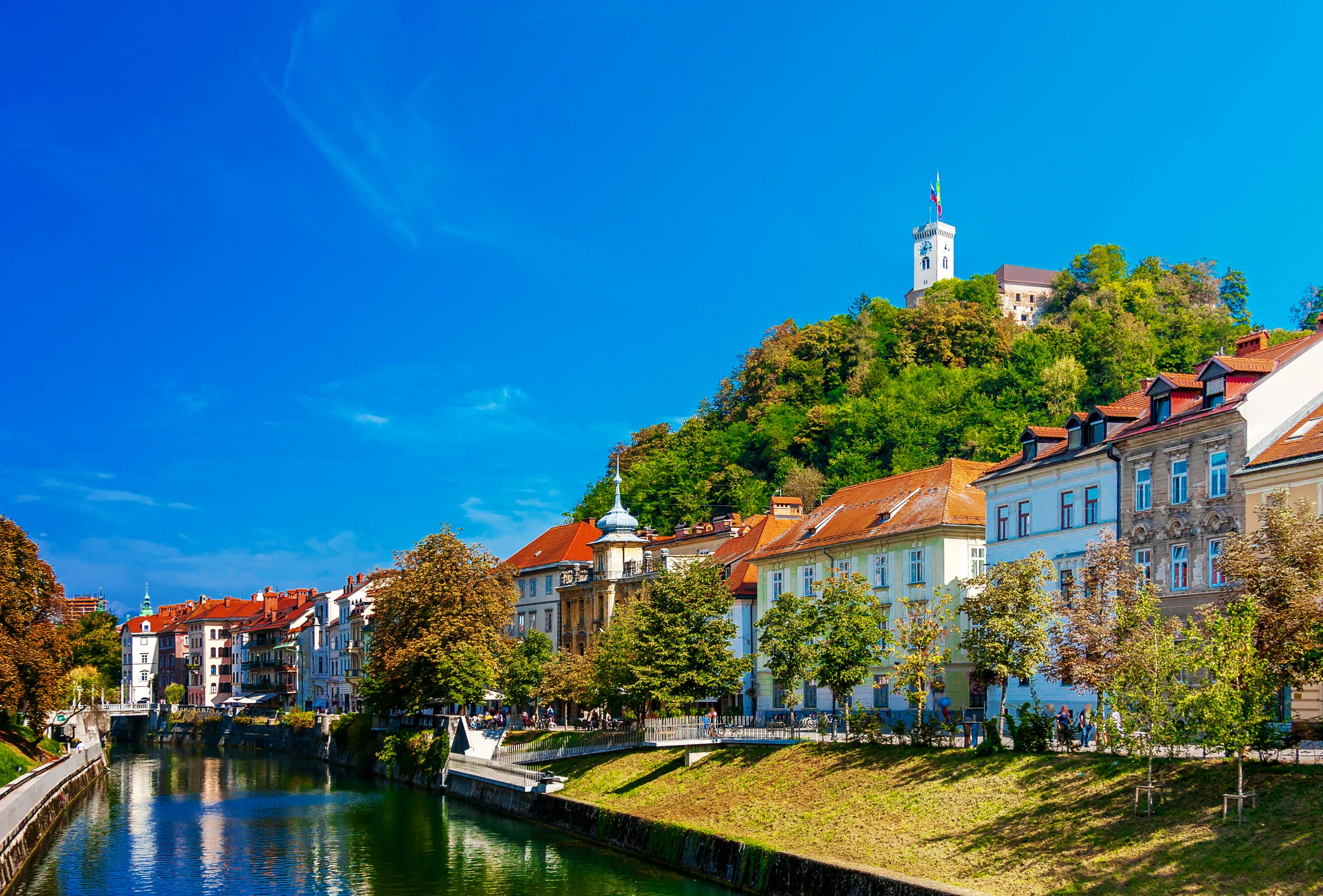 Riverside buildings along the Ljubljanica river in Ljubljana on a clear day
